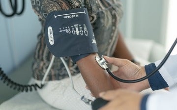 A mature woman at a routine medical check